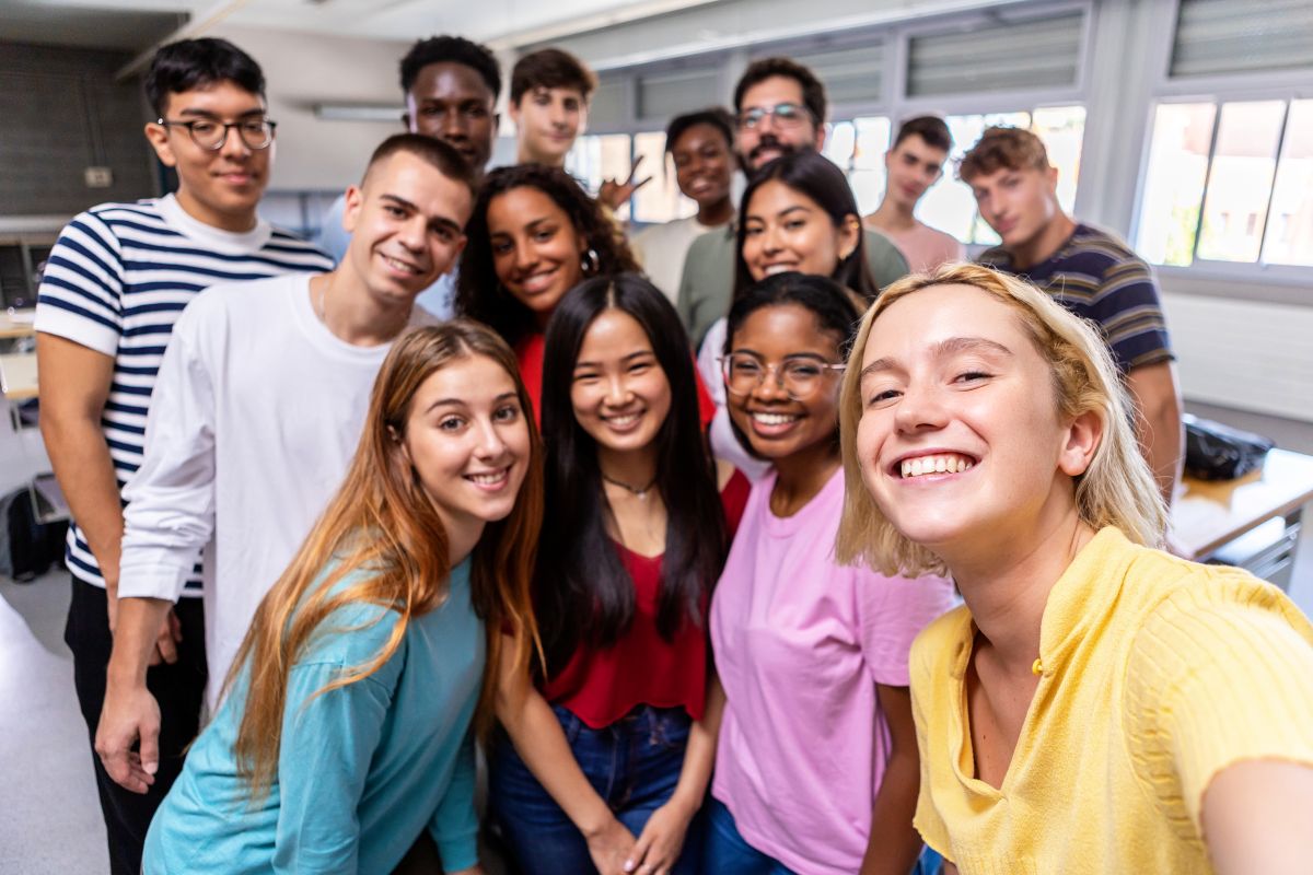 multiracial-group-of-student-friends-taking-selfie-
